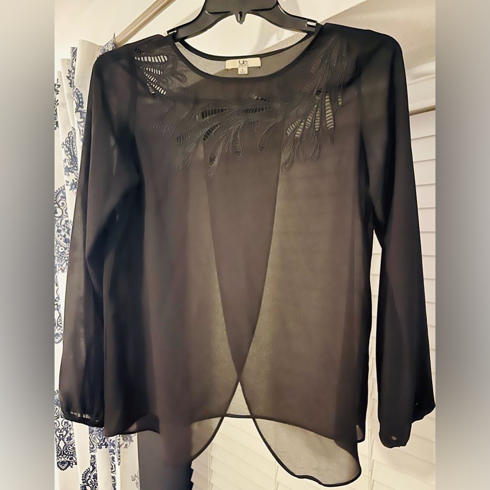 Cute work blouse with cutouts around neckline